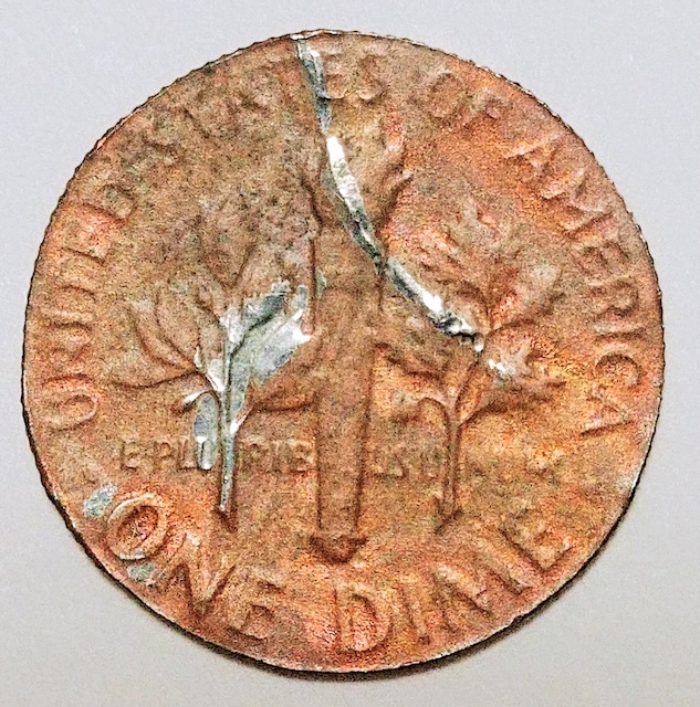 2019 Roosevelt dime missing clad layer error showing copper-red core exposed on one face